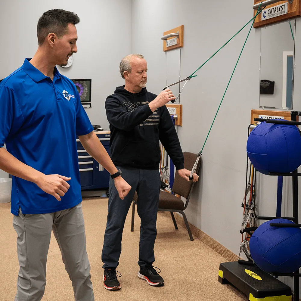 Patient doing resistance band rehab exercises