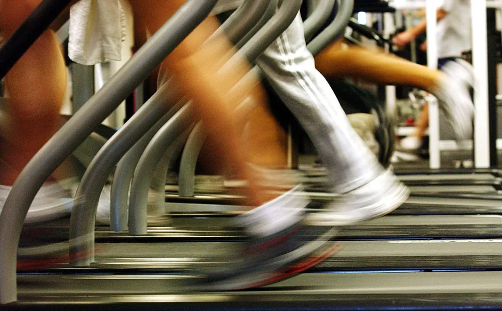 blurry image of people in gym