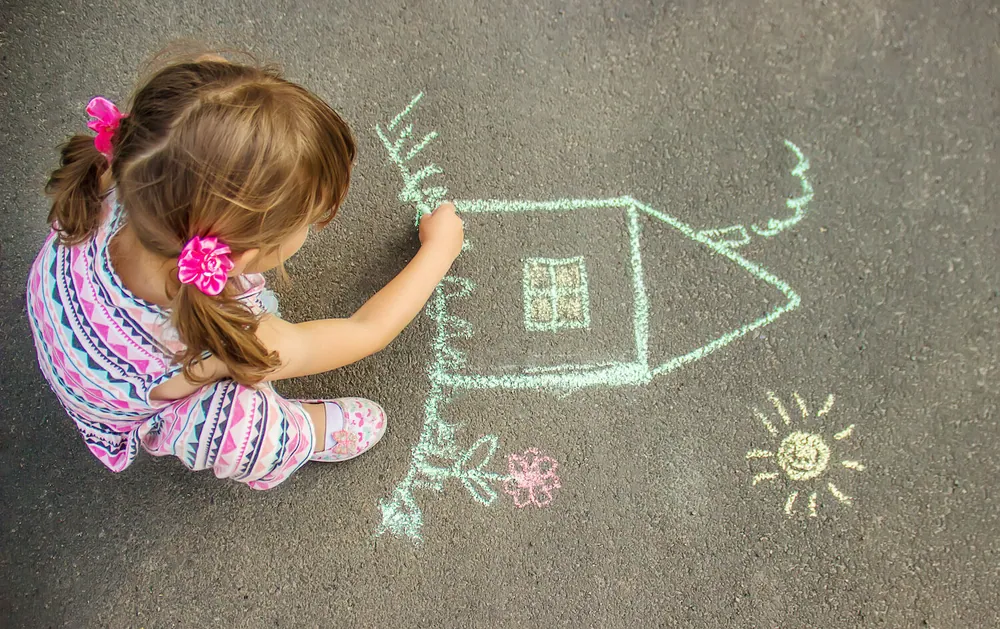 young girl making an art