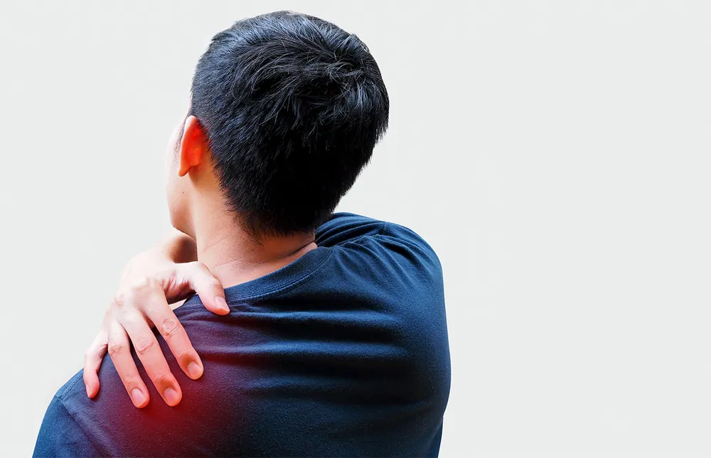 man having shoulder pain