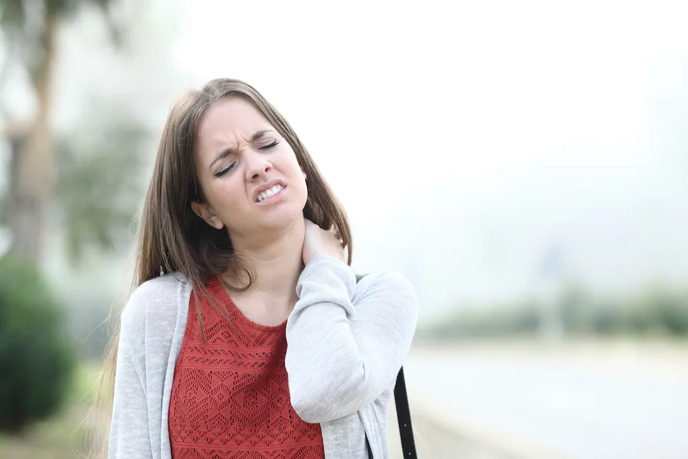 young woman suffer neck pain